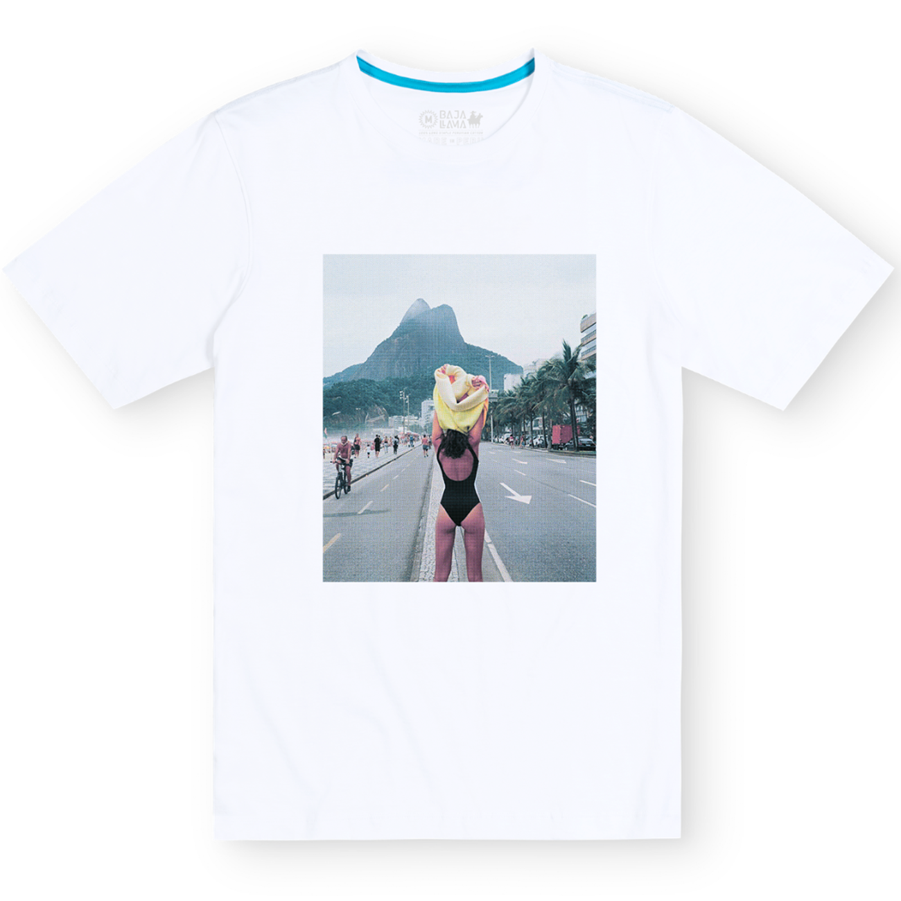 Front flat-lay view of the Baja Llama The Girl In Ipanema Primo Graphic Tee, featuring a white short-sleeve t-shirt with a large rectangular photographic print on the center chest depicting a woman in a swimsuit near Ipanema Beach.