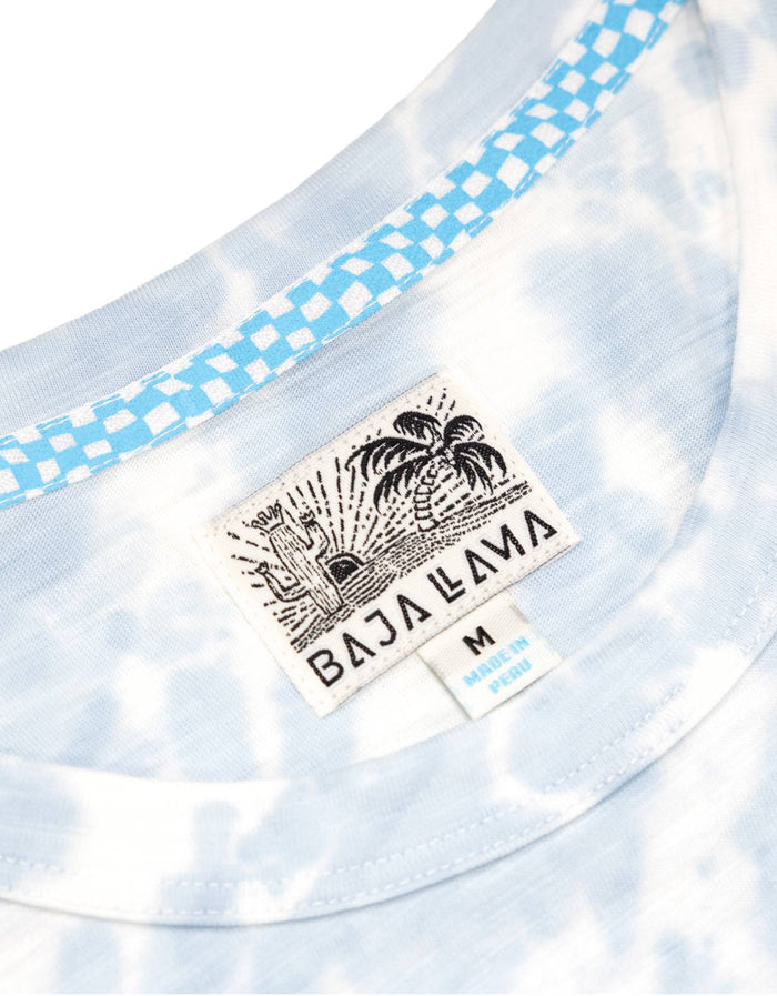 Neck label close-up of blue white Tie Dye Slub Pima tee with Baja Llama tag and checkered neck tape
