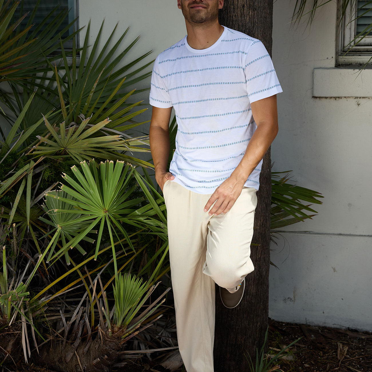 Baja Llama Ivory Morris Code Onassis Jacquard Tee styled with casual beige trousers outdoors