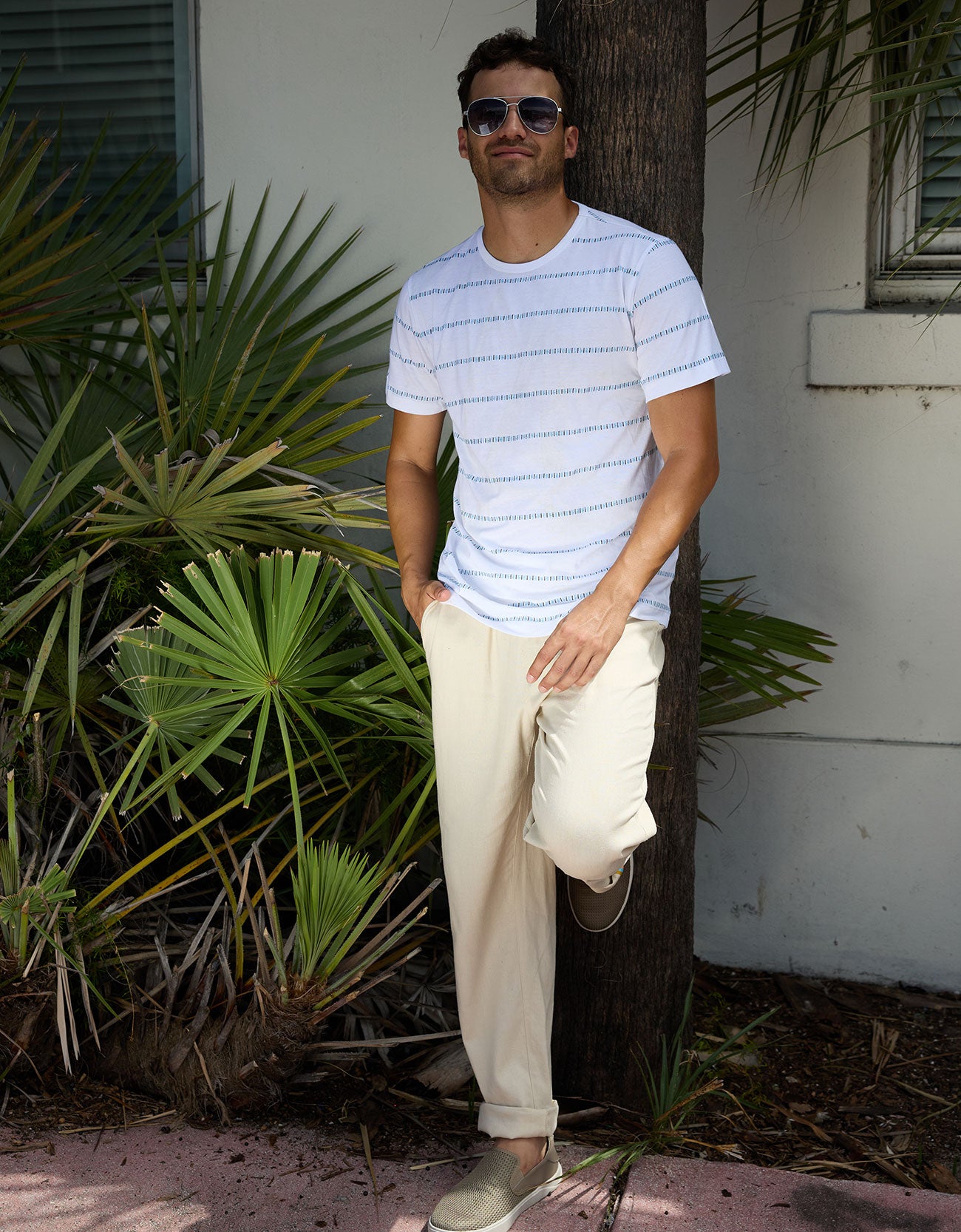 Baja Llama Ivory Morris Code Onassis Jacquard Tee styled with casual beige trousers outdoors
