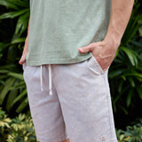 Baja Llama Too Easys Acid Washed Gray Stretch Cotton Shorts worn with a green t-shirt outdoors.
