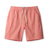 Coral pink linen shorts with a drawstring on a white background