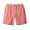 Coral pink linen shorts with a drawstring on a white background