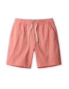 Coral pink linen shorts with a drawstring on a white background