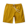 Mustard yellow linen shorts with a drawstring on a white background