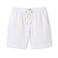 White linen shorts with a drawstring on a white background