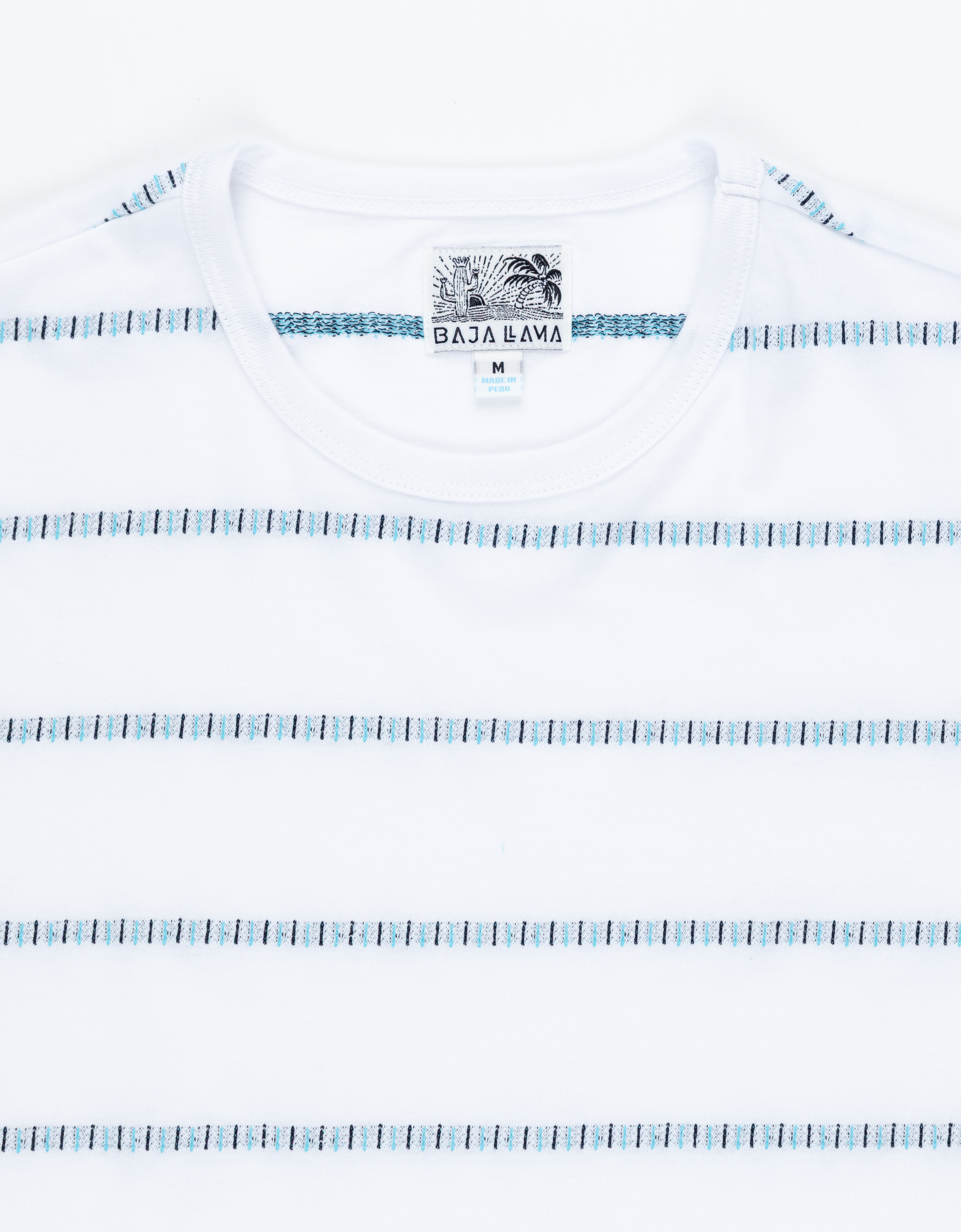 White t-shirt with blue pattern and 'Baja Bama' tag on a white background