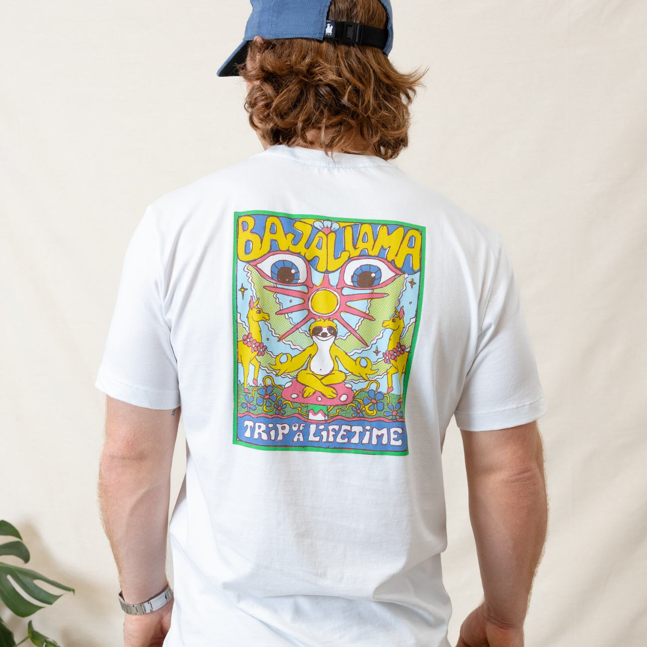 Peace Sloth graphic tee by Baja Llama. White tee with a sloth meditating on a mushroom alongside llamas. Soft fabric, relaxed fit, for a laid-back, adventurous vibe.