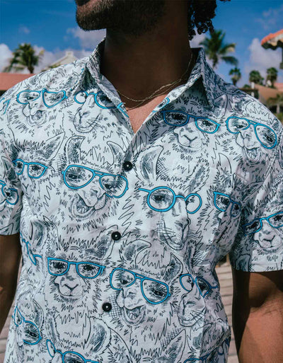 White and black button up shirt with llamas wearing blue eyeglasses print