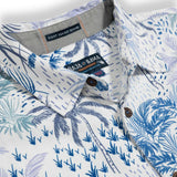 White button up shirt with tropical blue palm trees print in different hues 