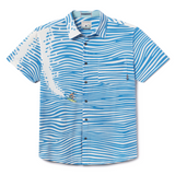Flat lay of 100 Foot Wave Vagabond recycled travel button-up shirt with bold print
